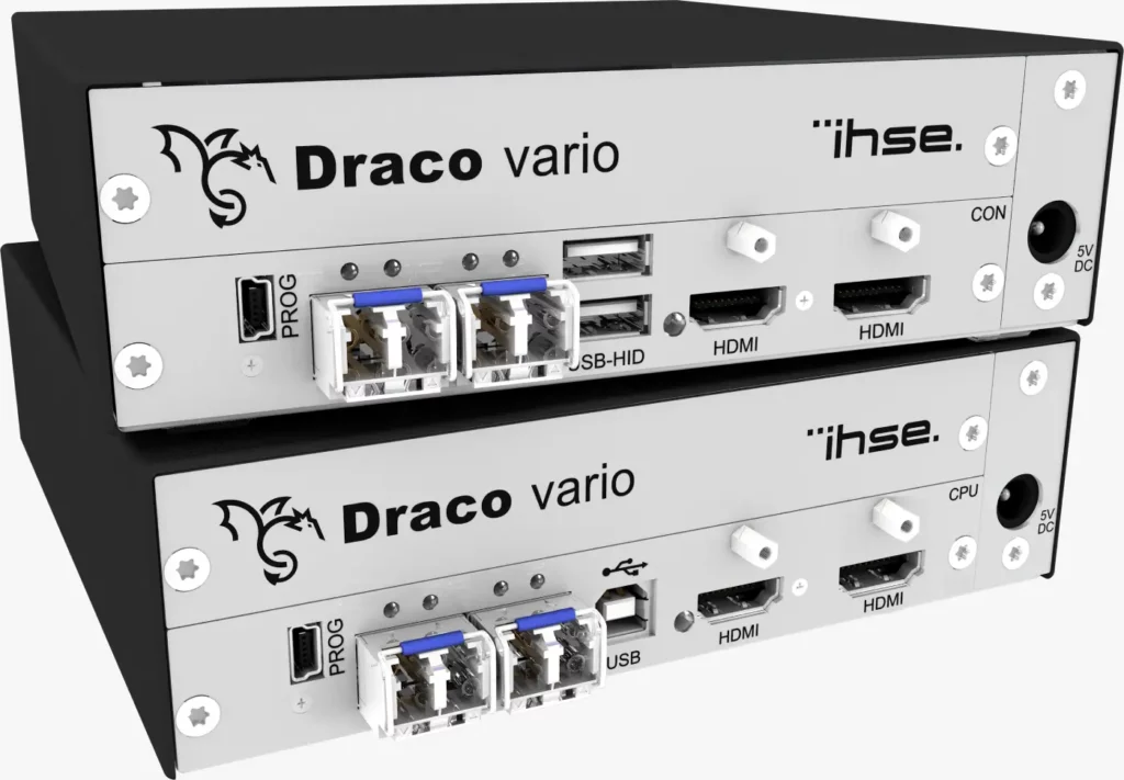 The image showcases the Draco KVM extender range, featuring a standalone console with two boxes. Its outer part is sleek black, while the front section, housing all the USB ports and connectors, is silver.